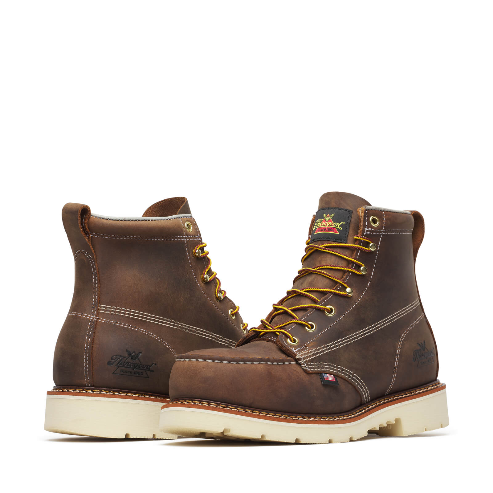 Close-up of 804-4375 6" Trail Crazyhorse Boots Boots showing Cream and tan stitching on dark brown leather upper, golden