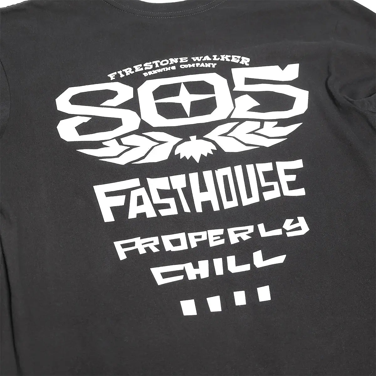 Close-up of 805 Gravel Black L/S Tee showing Charcoal black with white winged emblem and "905 FASTHOUSE PROPERLY CHILL" text
