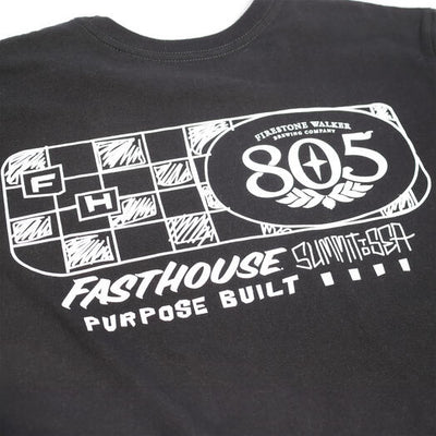 Close-up of 805 Purpose Black Tee showing White linework graphic with checkered flag pattern and oval 805 badge detail -