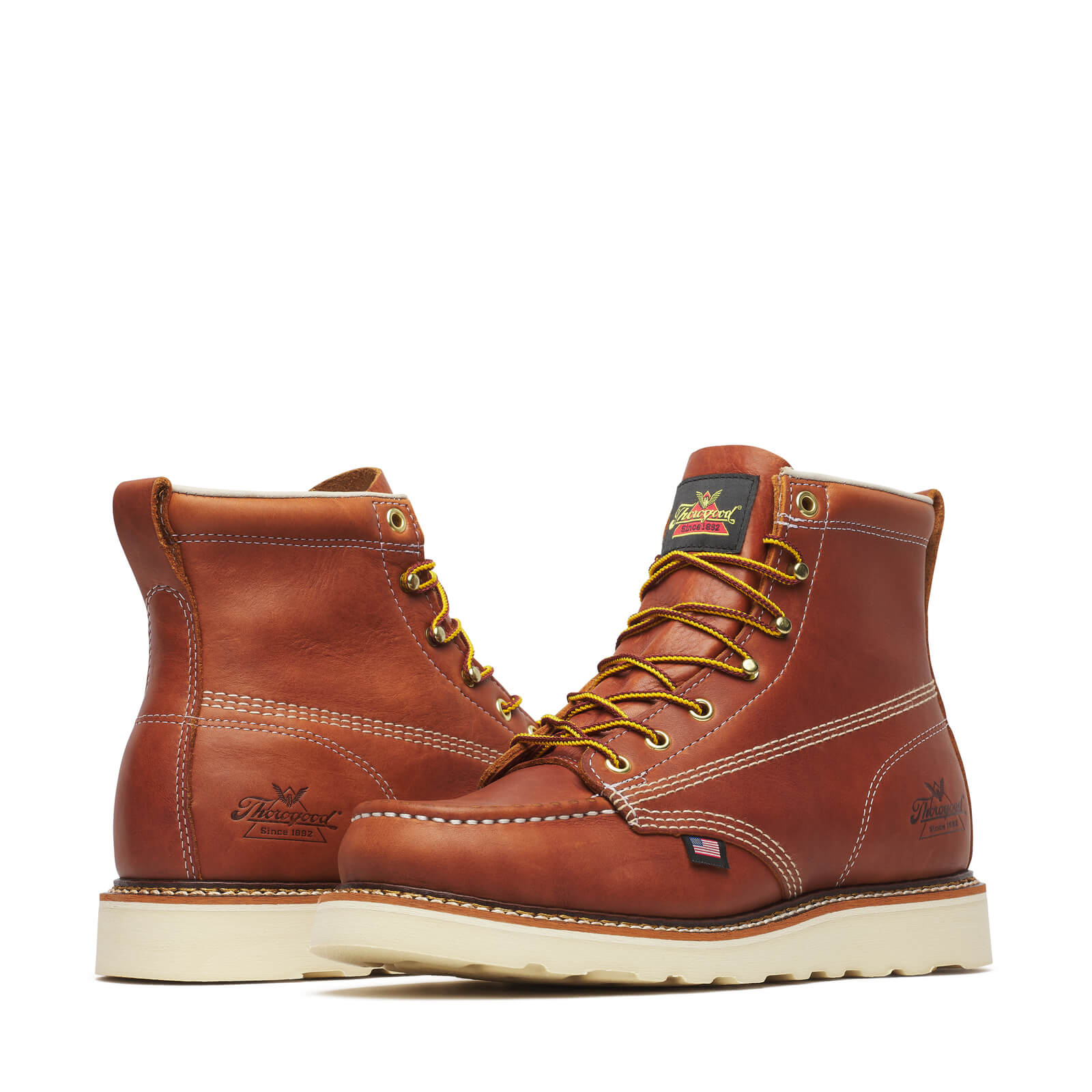 Close-up of 814-4200 6" Tobacco Boots Boots showing Tan stitching detail on cognac leather upper with cream wedge sole and