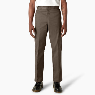 Person wearing 874 Original Work Pant Pants Black Pants, Olive work pants styled with white tank top and black leather boots