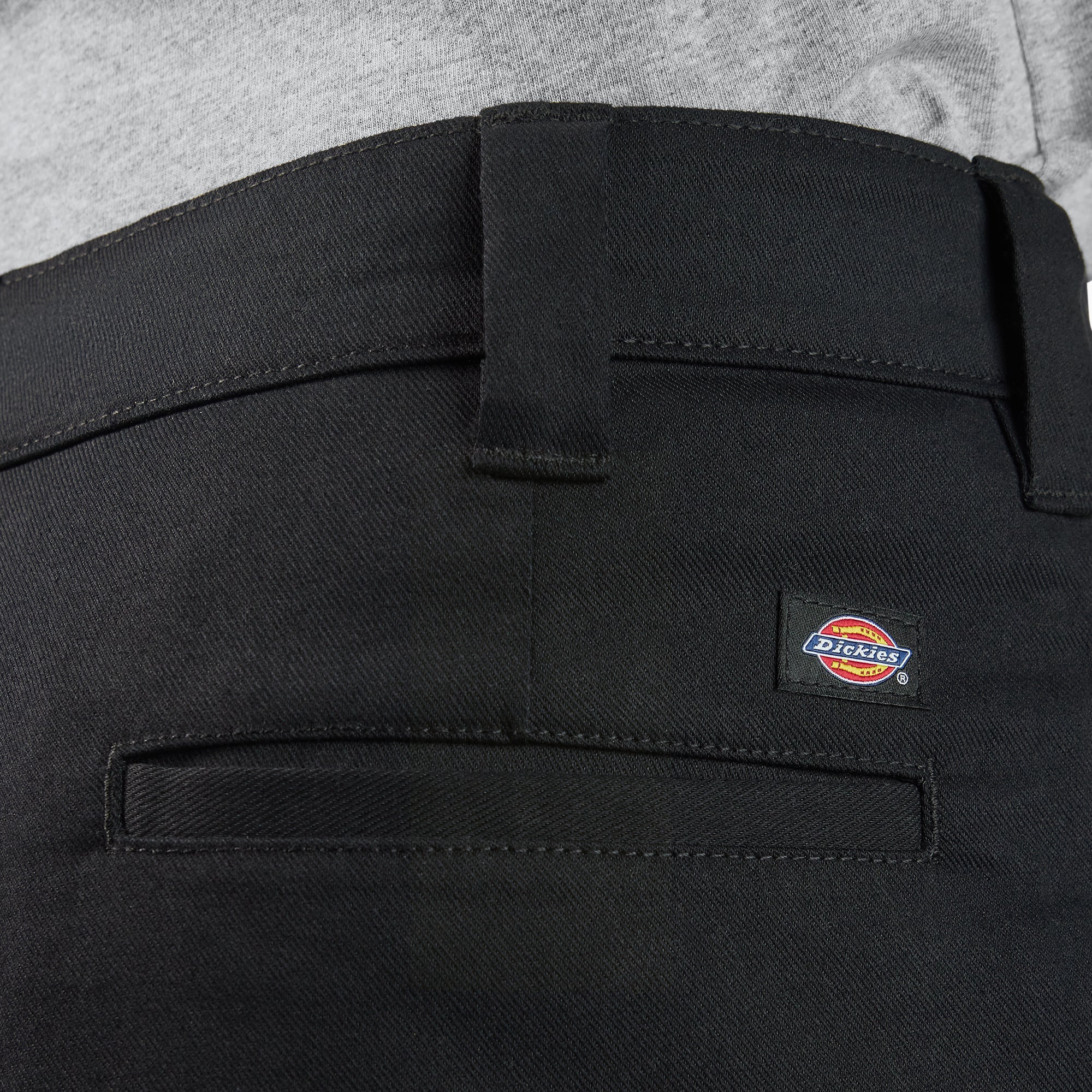 Close-up of 874 Pro Series Work Pant Pants Black Pants showing Black twill fabric with visible waistband stitching and woven
