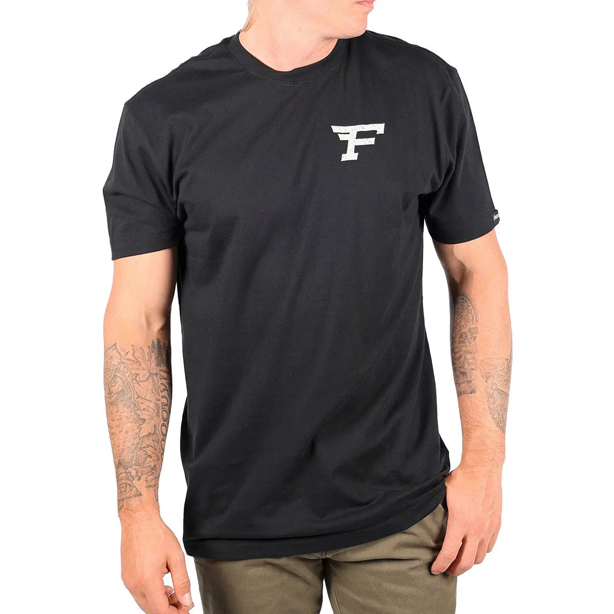 Person wearing Arthur Black Tee, Wearer posed against plain white background in neutral setting - Slowride Supply