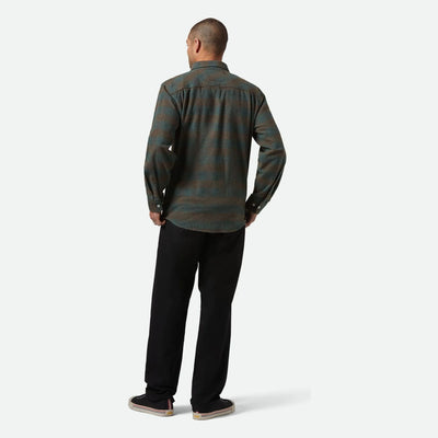 Person wearing Bowery Flannel Ocean L/S Woven L/S Woven, Neutral studio setting with white backdrop and flooring - Slowride