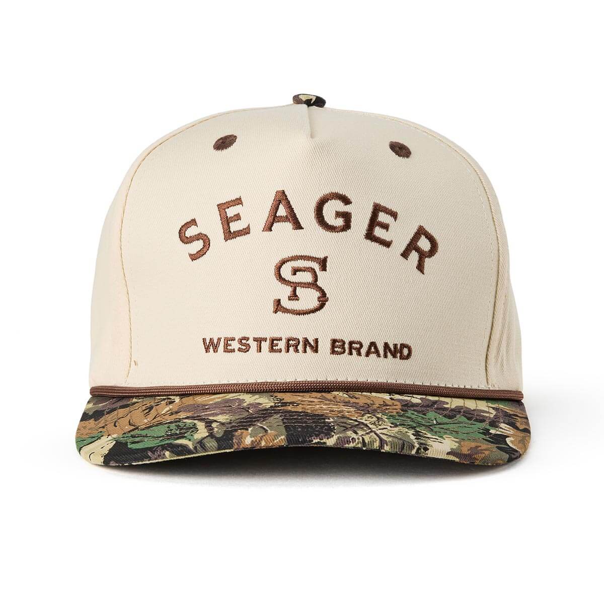 Close-up of Branded Snapback Hat Apparel Cream/Camo Apparel showing Cream crown with brown embroidered "Seager" text and "S"
