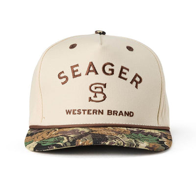Close-up of Branded Snapback Hat Apparel Cream/Camo Apparel showing Cream crown with brown embroidered "Seager" text and "S"