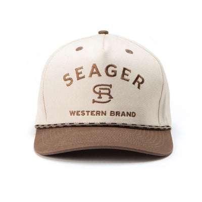 Close-up of Branded Snapback Cream/brown Hat showing Cream crown with brown embroidered lettering and monogram, tan visor