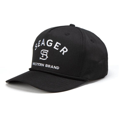 Close-up of Branded Trucker Black/Black Hat showing Black cotton twill cap with white embroidered "SEAGER" text,