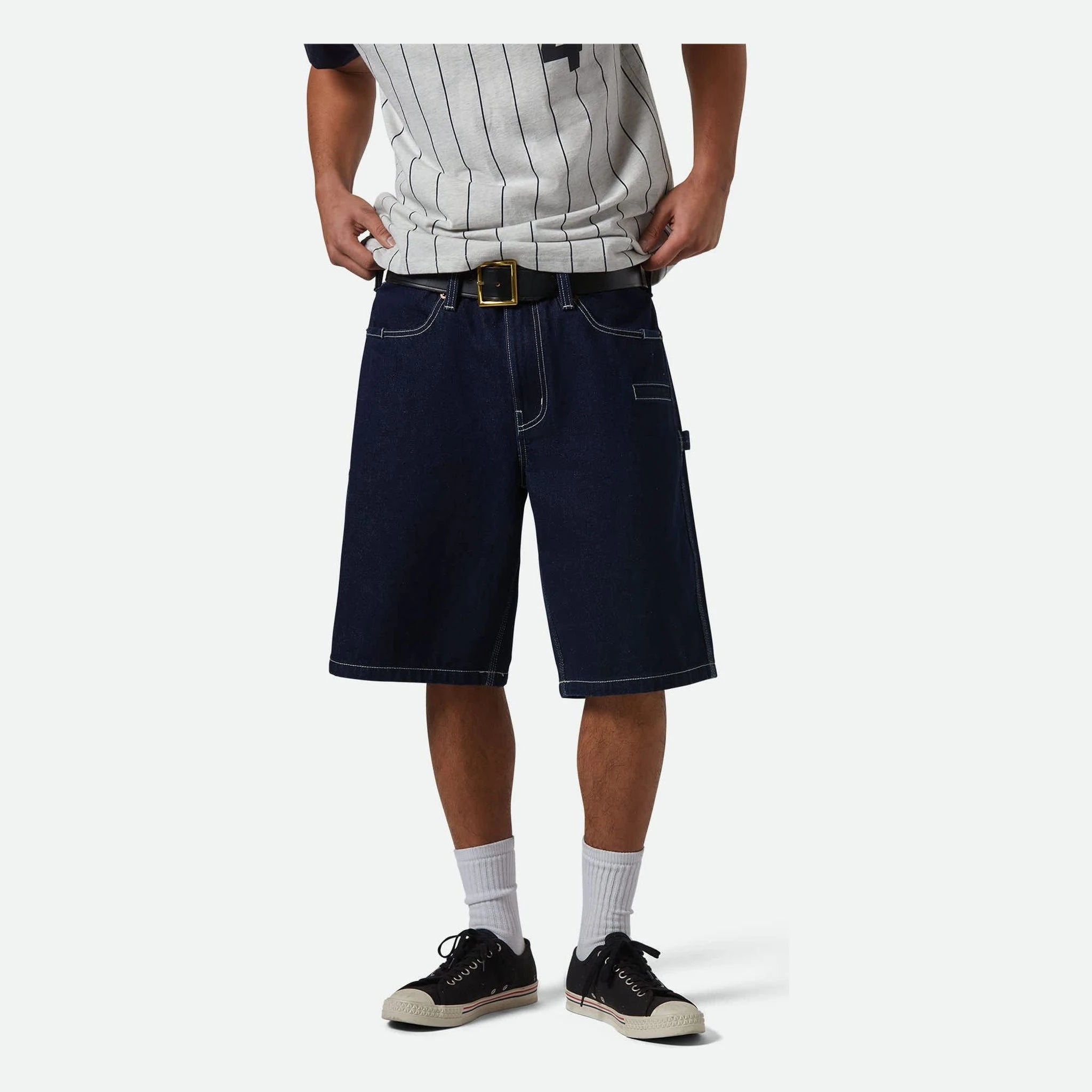 Person wearing Builders Carpenter Baggy Short Rinse Denim Shorts Shorts, Man standing against plain white background wearing