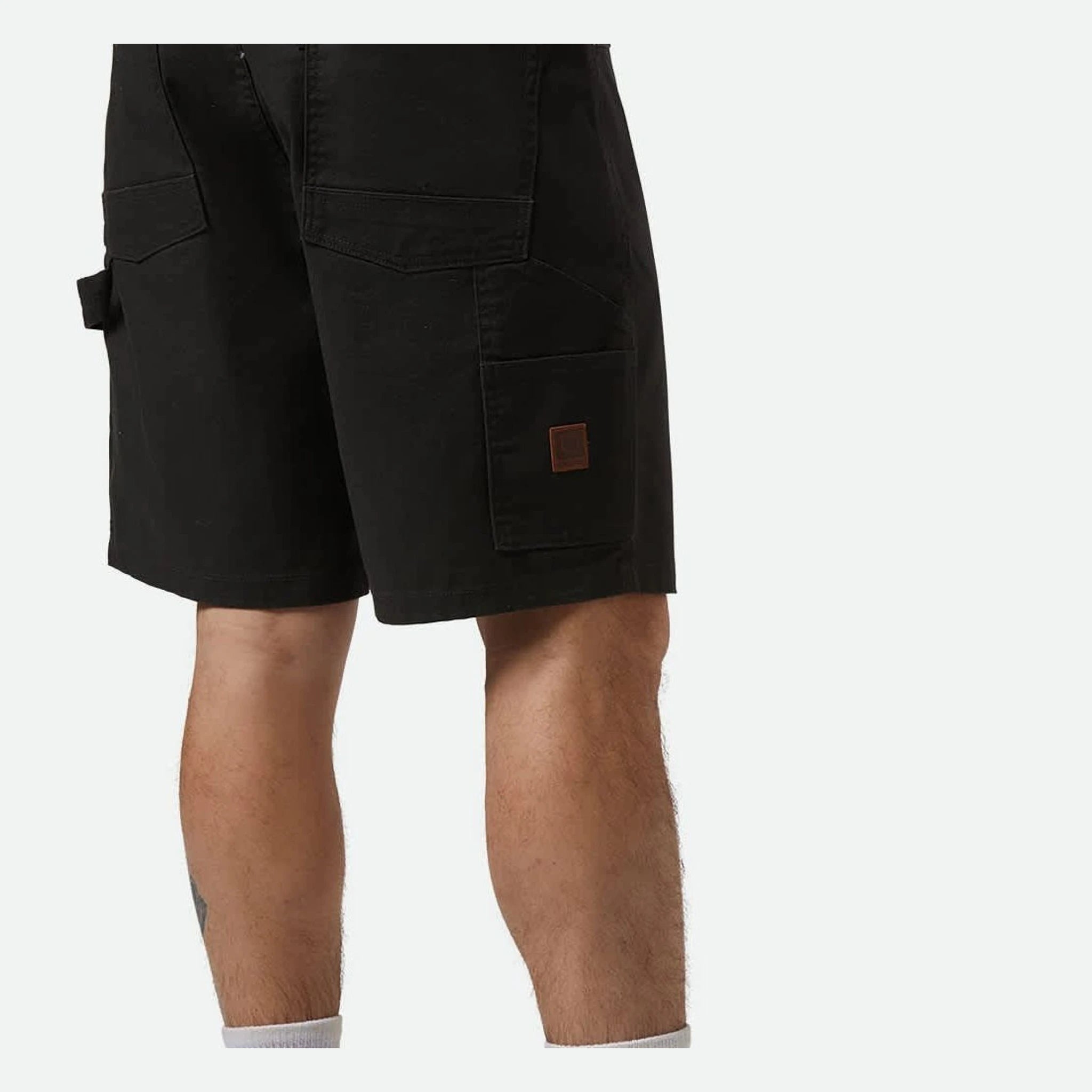 Person wearing Builders Carpenter Baggy Short Shorts Washed Black Shorts, Man wearing black carpenter shorts with multiple