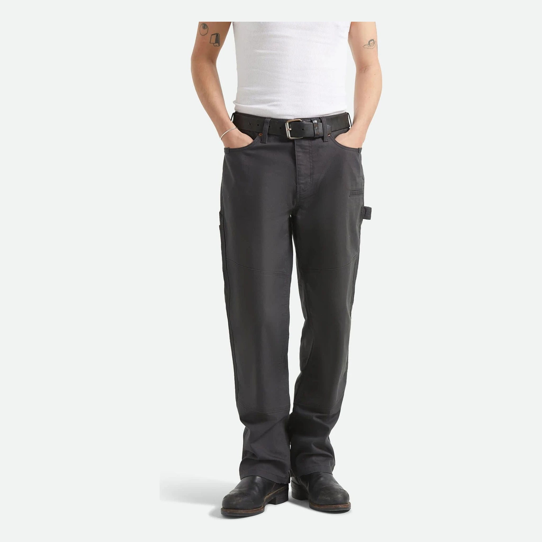 Person wearing Builders Carpenter Pant Pants Washed Black Pants, Wearer standing against neutral white background, wearing