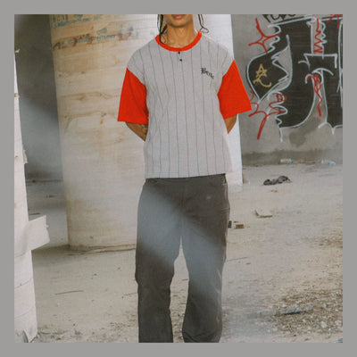 Person wearing Builders Carpenter Pant Pants Washed Black Pants, Worn in an industrial concrete garage with graffiti-covered