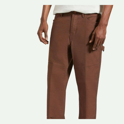 Person wearing Builders Carpenter Pant Pants Washed Black Pants, Neutral studio setting with plain white background -