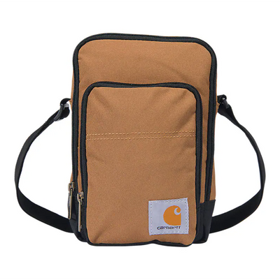 Crossbody Zip Bag Accessory front view, Tan canvas with black trim and orange logo patch on front pocket, Black Accessory -