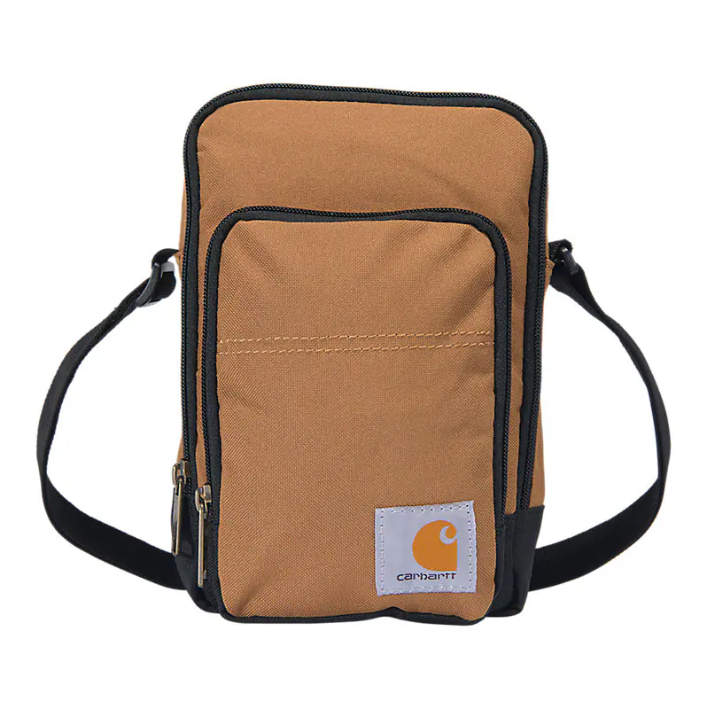 Crossbody Zip Bag Accessory front view, Tan canvas with black trim and orange logo patch on front pocket, Black Accessory -