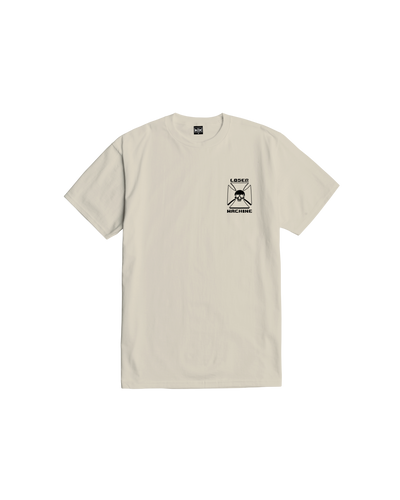 Close-up of Catacomb Black Tee showing Cream tee with small black chest print featuring skull and crossbones in geometric