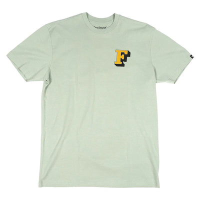 Close-up of Champions Choice Sage Tee showing Sage tee with yellow and black F logo on chest, small brand tab on right