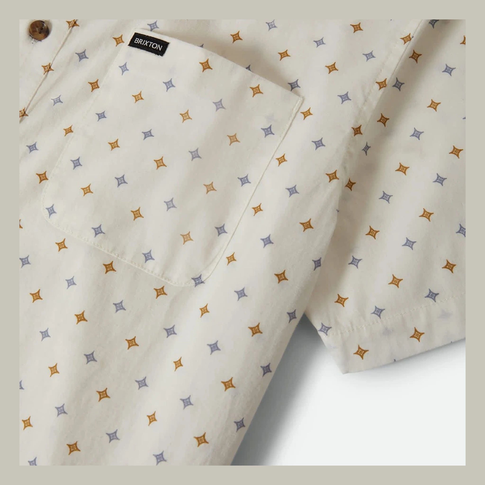 Close-up of Charter Print SS Woven S/S Woven Future Grey/ Diamond Tile S/S Woven showing Cream with allover four-pointed