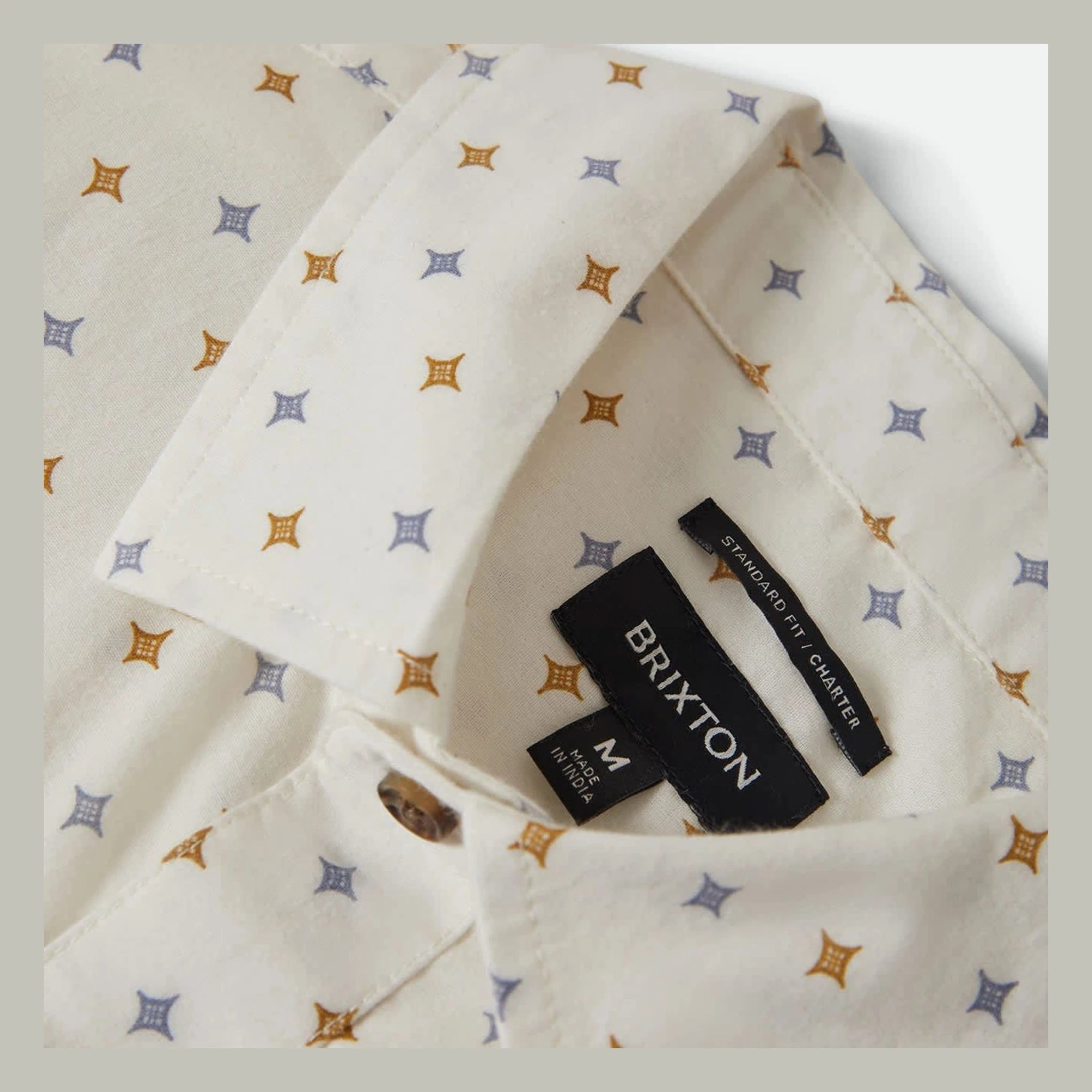 Care label on Charter Print SS Woven S/S Woven Future Grey/ Diamond Tile S/S Woven showing Black label reading "BRIXTON"