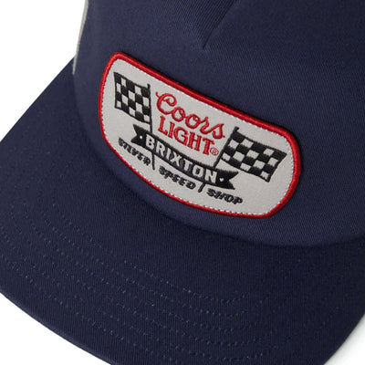 Close-up of Coors Light Pit Stop MP Trucker Navy/silver Hat showing Embroidered patch with red border, checkered flags and