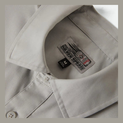 Care label on Coors Light Shake Down S/S Woven Silver/black S/S Woven showing Black size tag and gray printed label with