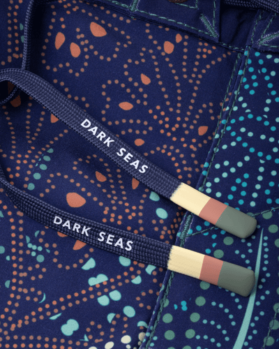 Care label on Deepwater Boardshort Boardshorts Navy Boardshorts showing White text reading "DARK SEAS" on navy webbing with