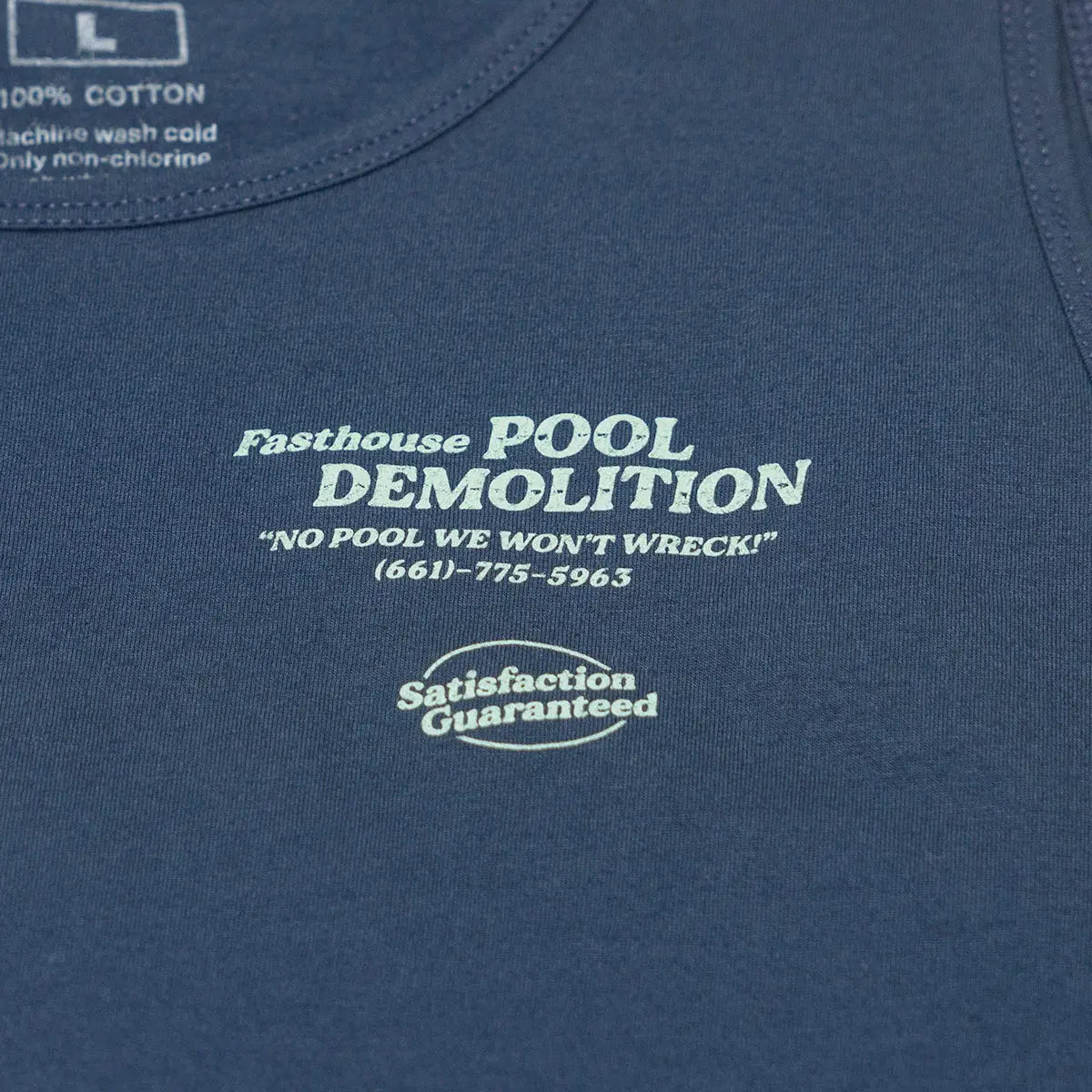 Close-up of Demolition Tank Top Navy Tank Top showing White embroidered text and oval graphic on navy cotton, detail of