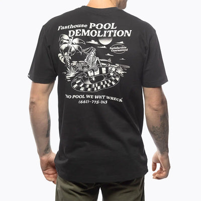 Person wearing Demolition Black Tee, Man wearing black tee standing against white studio background - Slowride Supply