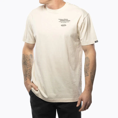 Person wearing Demolition Black Tee, Worn casually in neutral setting against plain white background - Slowride Supply