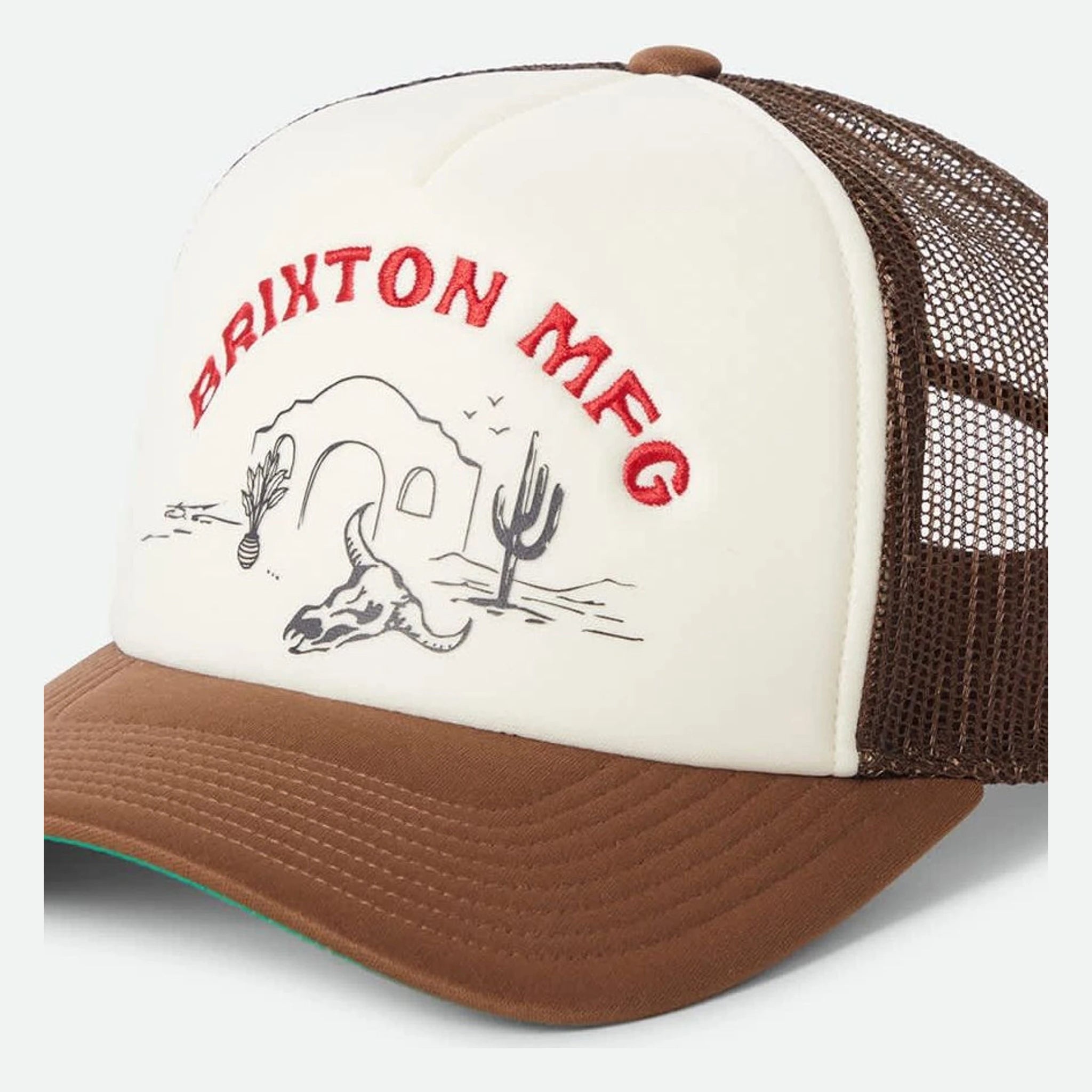 Desert Leisure MP Trucker Apparel front view, Cream front panel with red embroidered text and desert skull graphic, brown