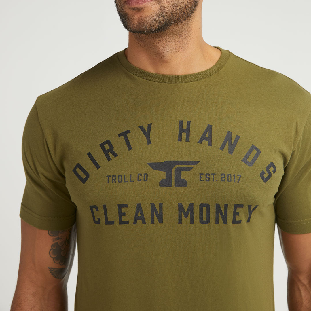 Person wearing DHCM Classic Black Tee, Olive green tee worn casually against neutral studio background - Slowride Supply