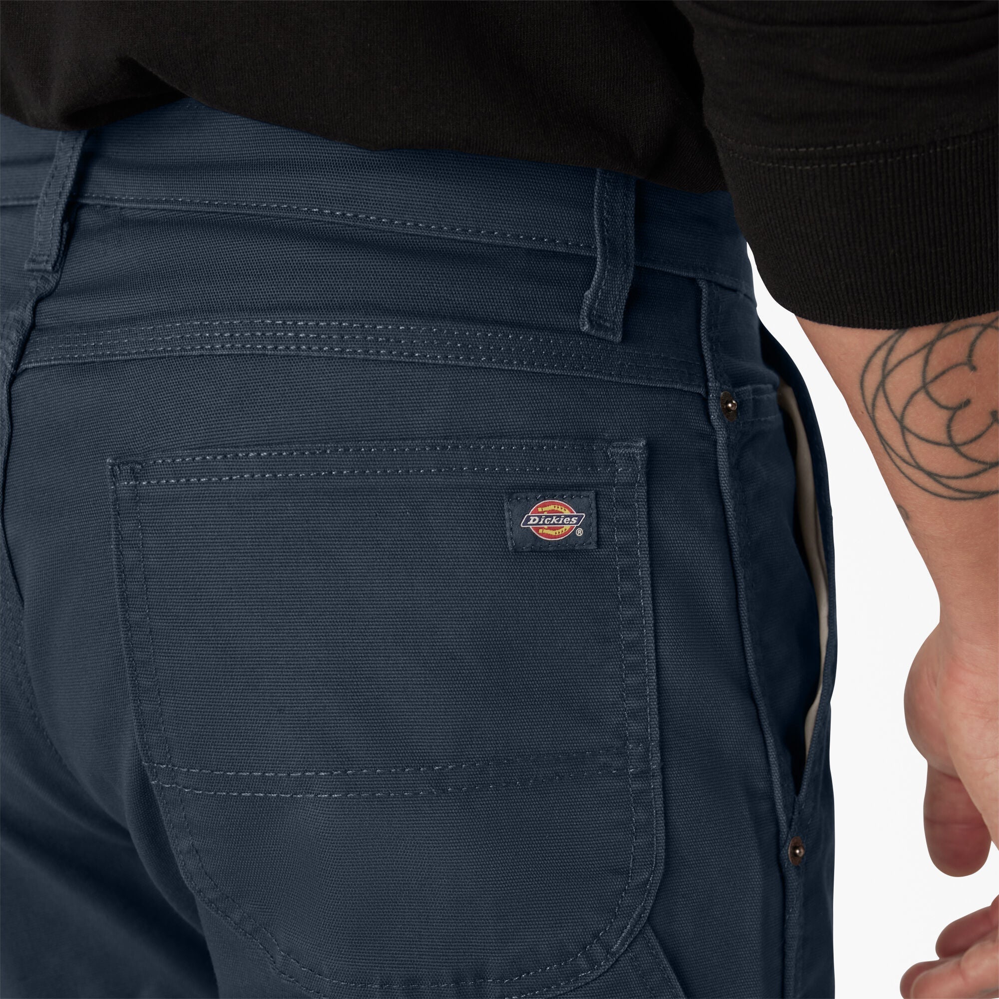 Person wearing Dp802 Carpenter Pant Regular Fit Pants Stone Washed Black Pants, Navy work pants worn casually against white