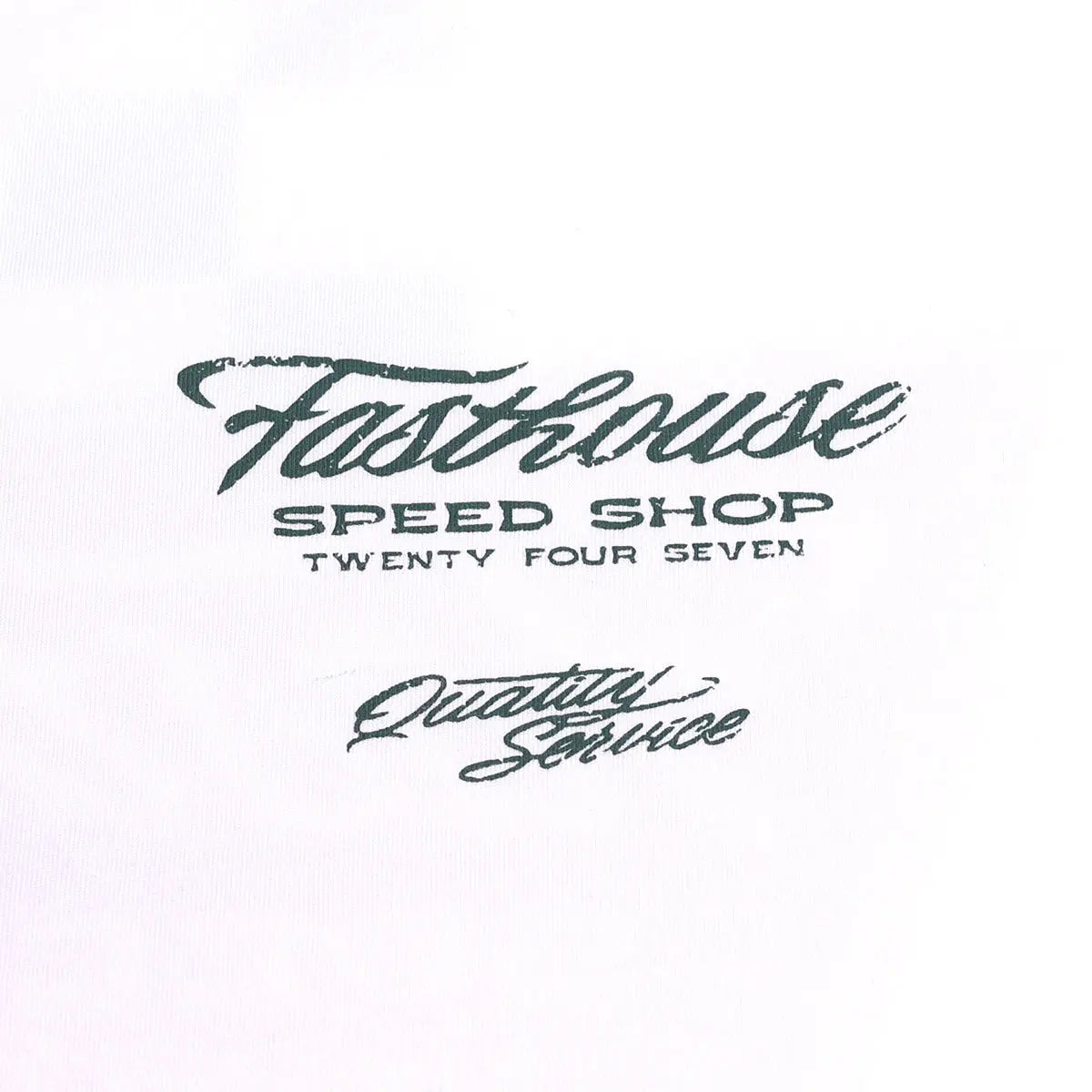 Care label on Drive in Black Tee showing Dark teal script reading "Speed Shop Twenty Four Seven" with "Quality Service"