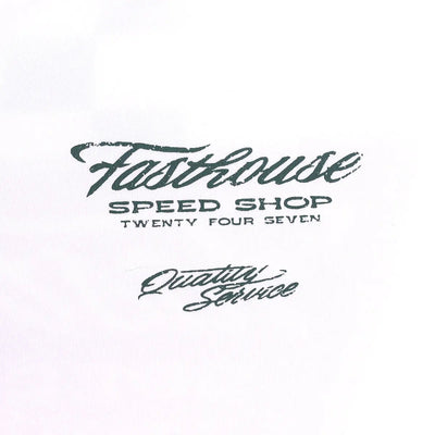 Care label on Drive in Black Tee showing Dark teal script reading "Speed Shop Twenty Four Seven" with "Quality Service"