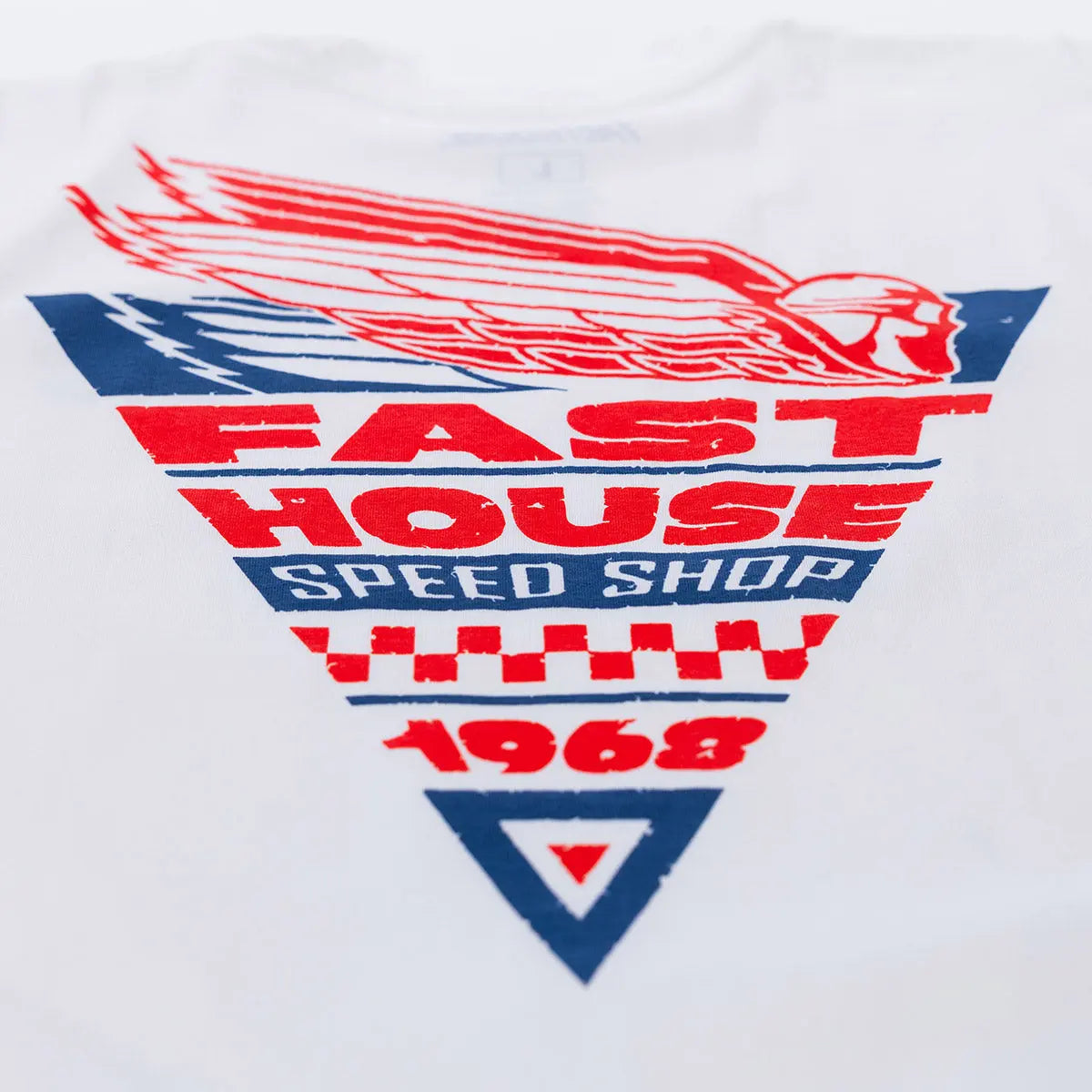 Close-up of Flyer White Tee showing Layered shield graphic with red winged emblem, red and navy text bands, checkered flag