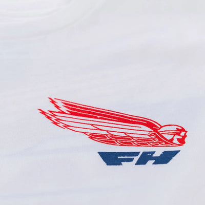 Close-up of Flyer White Tee showing Red winged emblem with blue text underneath, embroidered on white fabric - Slowride