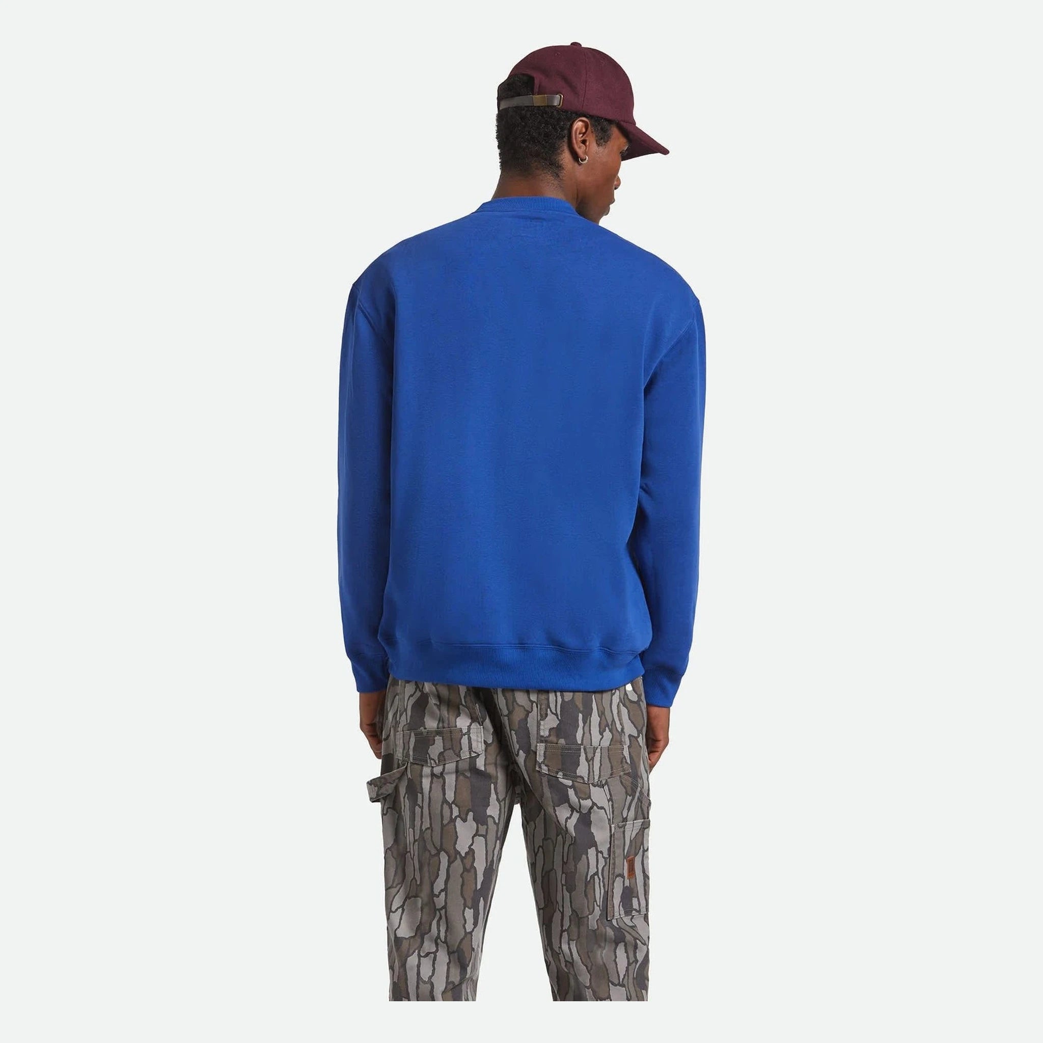 Person wearing Ford Number One Fleece Crew Ford Blue Crewneck, Person wearing blue crew sweatshirt against neutral studio