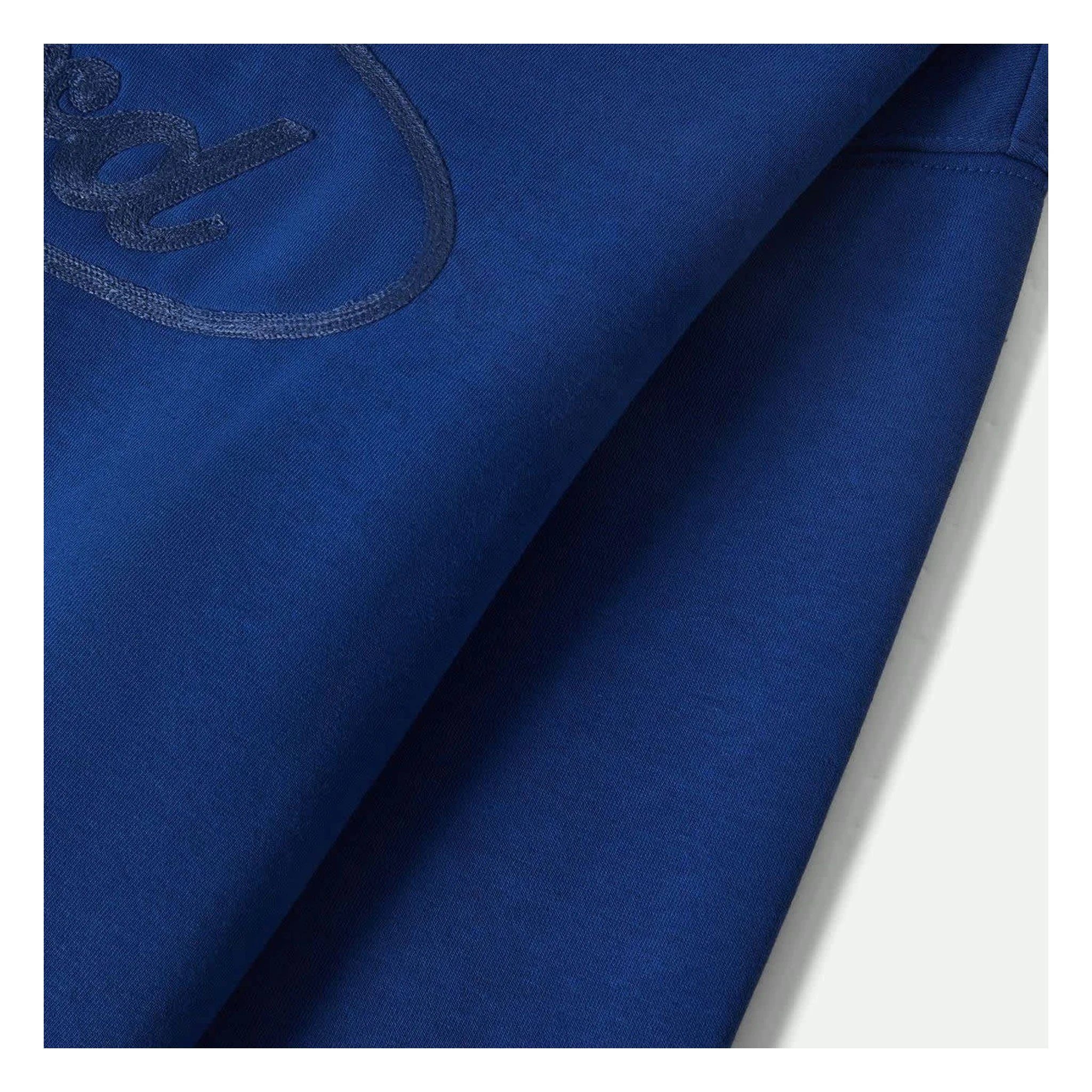 Close-up of Ford Number One Fleece Crew Ford Blue Crewneck showing Embroidered oval graphic with script lettering on blue
