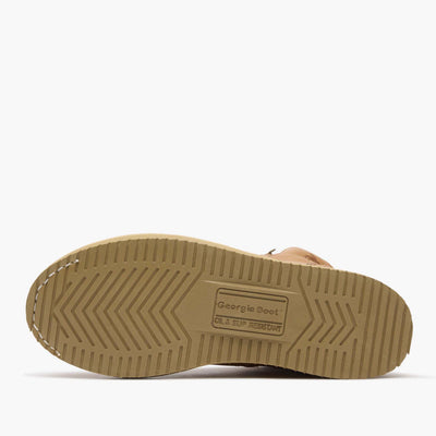 Close-up of G6342 6" ST Wedge Barracuda Boots Gold Boots showing Tan rubber sole with chevron tread pattern and oil slip