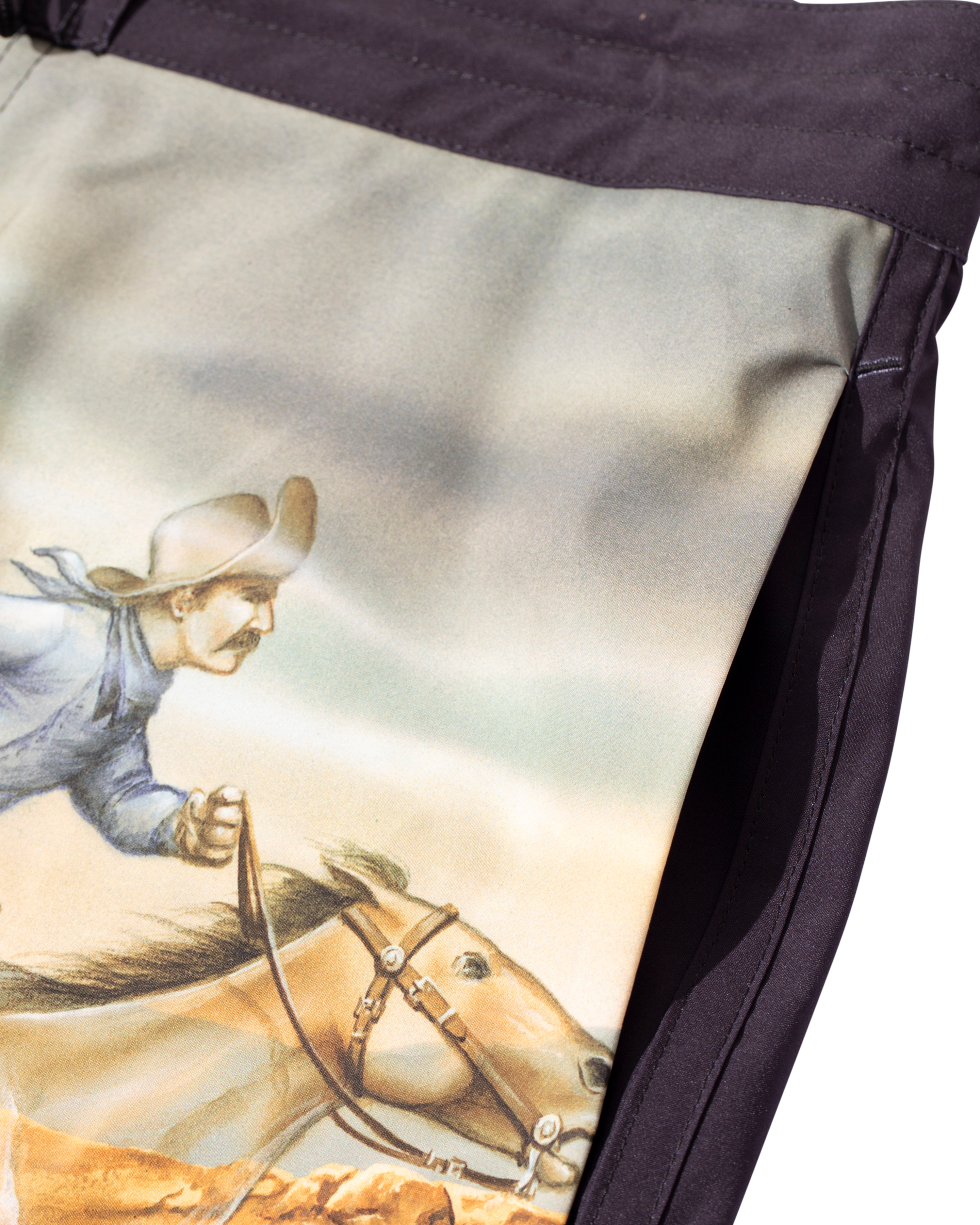 Close-up of Ghost Rider Boardshort Boardshorts Black Boardshorts showing Cowboy and horse illustration detail with