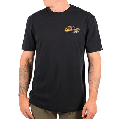Person wearing Gilmore Black Tee, Worn against a plain white background with wearer's tattooed arms visible - Slowride Supply