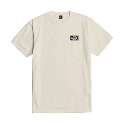 Close-up of Good Luck Fingers Black Tee showing Cream colored tee with small black and white rectangular chest logo patch -