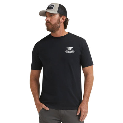 Person wearing Haggler Black Tee, Man wearing black tee against white background, studio setting - Slowride Supply