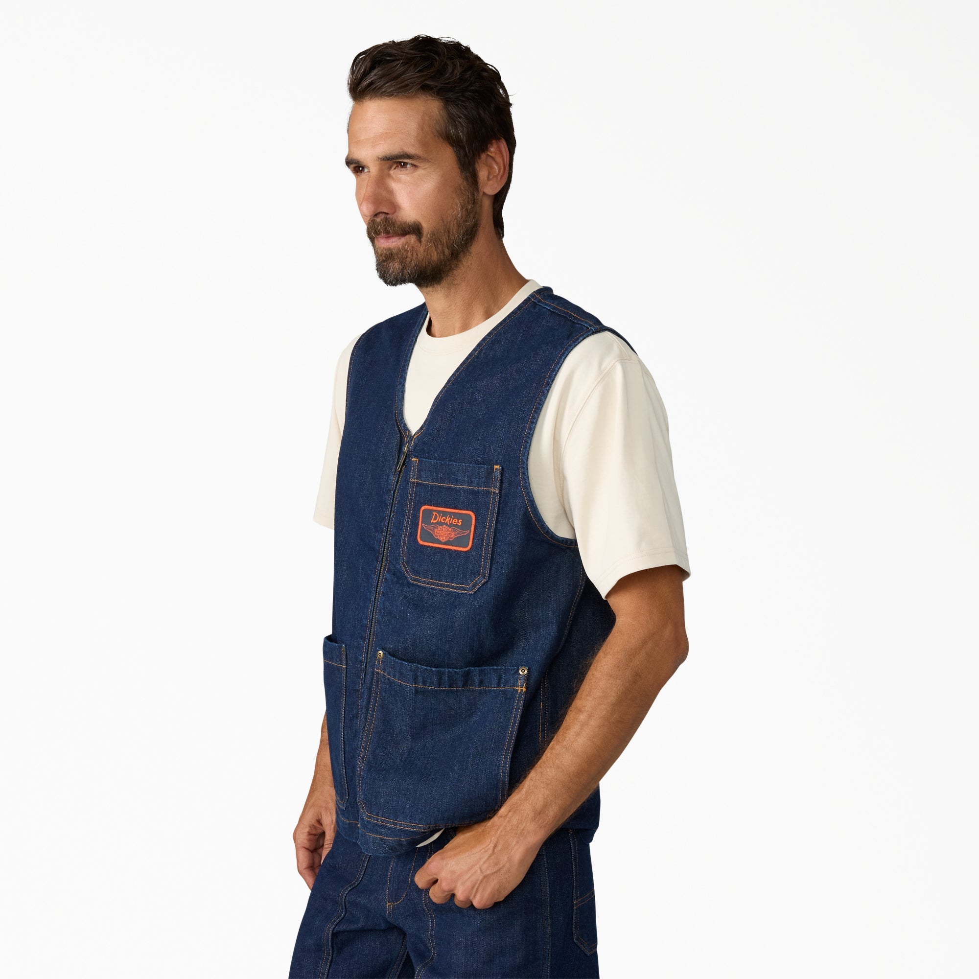 Person wearing Hdxdickies Denim Lined Vest RNB Vest Vest, Man wearing denim vest in neutral studio setting against white