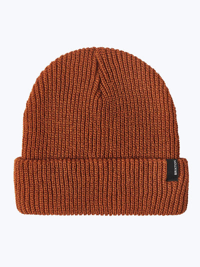 Close-up of Heist Mustard Beanie showing Rust-orange ribbed knit beanie with small dark woven label at cuff - Slowride Supply