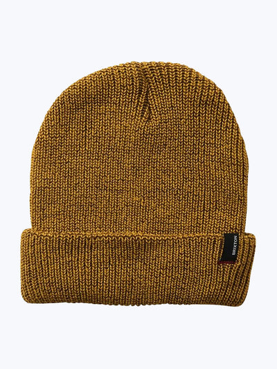 Close-up of Heist Mustard Beanie showing Mustard knit beanie with ribbed cuff and small woven label patch at fold - Slowride
