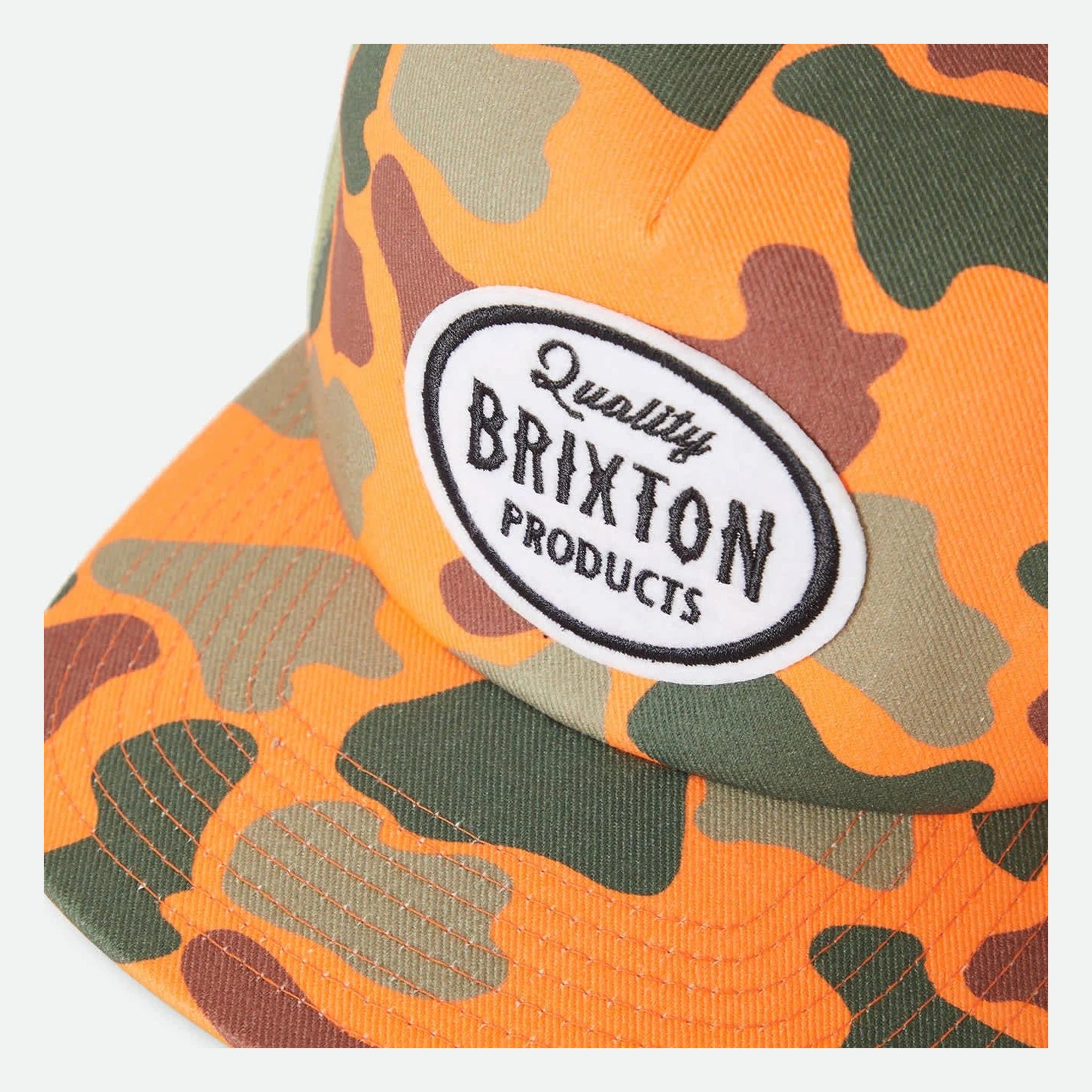 Close-up of Henry MP Trucker Hat Apparel Orange Duck Camo/Orange Apparel showing White oval patch with black embroidered