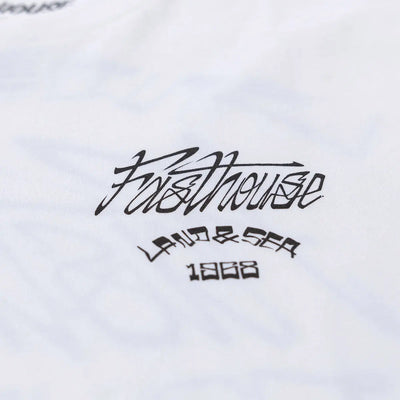 Close-up of Horizon Black Tee showing Black script text and year mark printed on white fabric surface - Slowride Supply