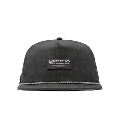 Close-up of Hydro Coronado Brick Black Hat showing Black woven fabric with white rope trim along brim, black rubber patch