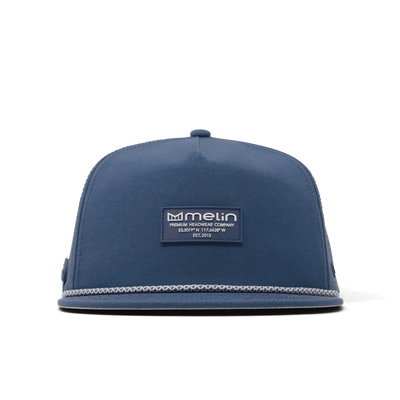 Close-up of Hydro Coronado Brick Black Hat showing Slate blue snapback with woven rope trim along bill, embroidered brand